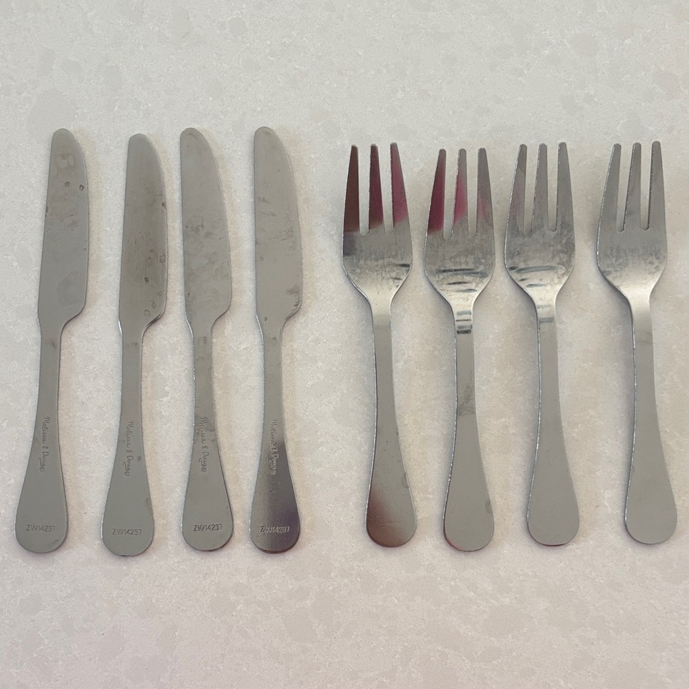 Melissa and Doug play forks and knives.
